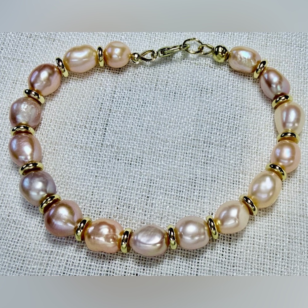 Natural freshwater pearls beaded bracelet,gold plated spacers.Size 7.5”.